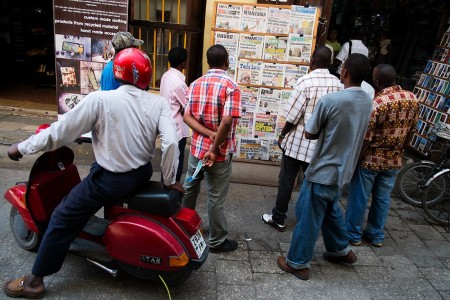People read the papers Friday morning in Stone Town, Zanzibar. Photo: Daniel Hayduk